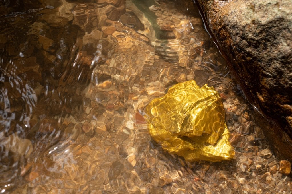 Pure gold nugget ore found in mine with natural water sources